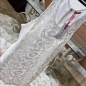 Gorgeous white top with pleather print